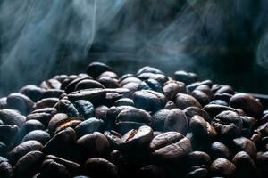 Coffee beans roasting with smoke,  selective focus, and soft focus. photo