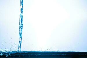 splashing water droplets on a white background photo