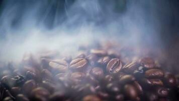 Coffee beans roasting with smoke,  selective focus, and soft focus. photo