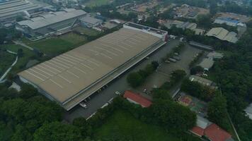 Bogor, Indonesia - 2022. aerial view of office building and warehouse distribution center of retail based company at daytime. photo