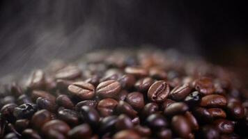 Coffee beans roasting with smoke,  selective focus, and soft focus. photo