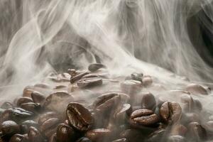 Coffee beans roasting with smoke,  selective focus, and soft focus. photo