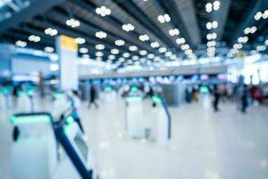 Blurred images of Self-service check-in machine at Check-in counters at Suvarnabhumi International Airport photo