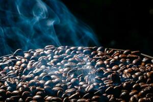 Coffee beans roasting with smoke,  selective focus, and soft focus. photo