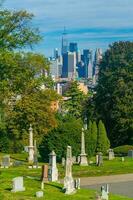 View of Green Wood cemetery in Brooklyn with Manhattan city skyline photo