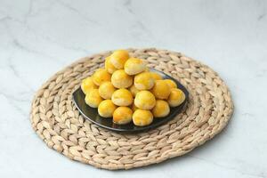 nastar cookies, pineapple tarts or nanas tart are small, bite-size pastries photo