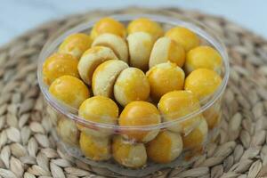 nastar cookies, pineapple tarts or nanas tart are small, bite-size pastries photo