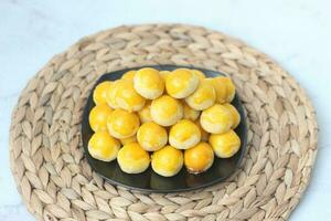 nastar cookies, pineapple tarts or nanas tart are small, bite-size pastries photo