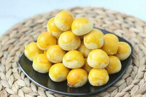 nastar cookies, pineapple tarts or nanas tart are small, bite-size pastries photo