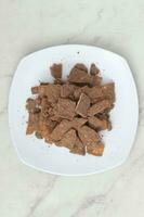 banana chips with cocoa powder served on a white plate photo