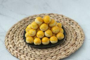 nastar cookies, pineapple tarts or nanas tart are small, bite-size pastries photo