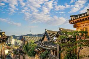 Bukchon Hanok Village with Seoul city skyline, cityscape of South Korea photo