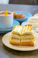 Traditional breakfast set and coffee, boiled eggs and toast, popular in Singapore photo