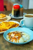 Traditional breakfast set and coffee, boiled eggs and toast, popular in Singapore photo