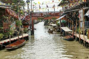 BANGKOK, THAILAND May 03, 2019 Damnoen Saduak Floating Market is a floating market in Damnoen Saduak District, Ratchaburi Province, about 100 kilometers southwest of Bangkok. photo