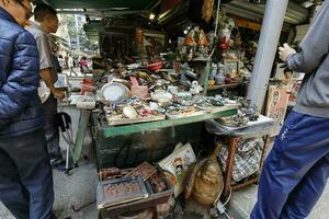 SHEUNG WAN, HONG KONG  March 12, 2019 known as Cat Street, Upper Lascar Road, Bustling street dotted with an array of vendors selling antiques, art  souvenirs. photo