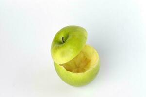 Healthy Green Cut Apple floating top slice juice drink idea concept on white background photo