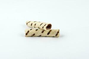 Mini Chocolate vanilla waffle tube biscuit on white background photo