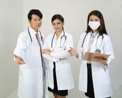 Young Asian male female doctor wearing apron uniform tunic apron hold photo