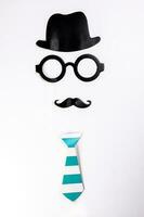 Black hat round eyewear spectacle frame moustache blue neck bow tie face shape paper die cut selfie portrait party fun paper prop sticker stick on white background photo