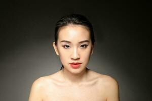 Young beautiful Asian woman facial expression photo