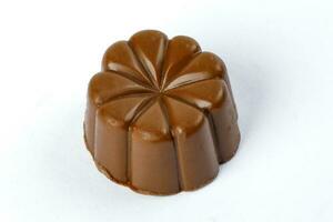 Chocolate truffle hart square cube rose flower shape on white background photo