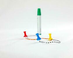 Colorful Paper board pin clip on white background route map photo
