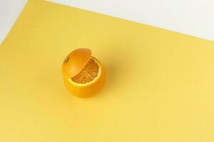 Healthy Orange Cut floating top slice juice drink idea concept on yellow white background photo