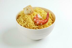 Fresh yellow egg noodle prawn tofu in bowl on whit background photo