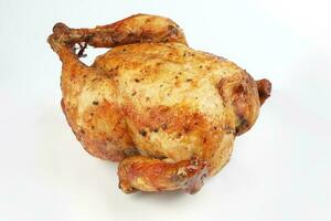 Whole roasted grilled chicken poultry bird on white background photo