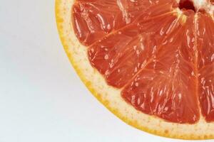 Ruby red grapefruit cut closeup photo