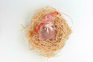 Egg flower or bunga telur a traditional malay wedding gift important part of reception door gift in straw bird nest photo