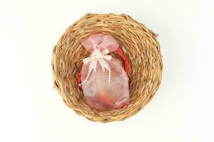 Egg flower or bunga telur a traditional malay wedding gift important part of reception door gift in straw basket photo
