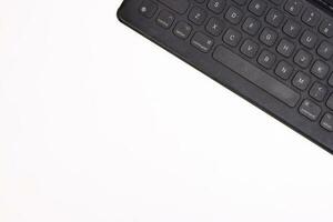 Black computer keyboard on white background top view copy text space photo