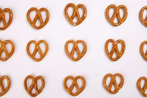 Pretzel cracker laid in rows design on what background photo