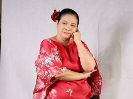 Elderly senior Asian woman posing facial expression photo