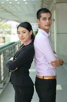 Young south east Asian middle eastern man woman business colleague outdoor stand pose photo