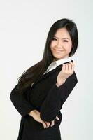 One young Asian Malaysian business office woman holding blank copy text space sign board on white background photo