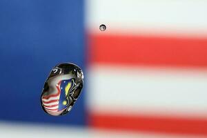 Water droplet drop splash collision dripping pillar Malaysia Flag reflection refraction independence country patriot photo