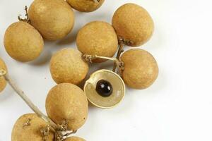 cats eye mata Kuching fruit on white backgroun d photo