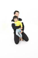 South East Asian young father mother daughter son parent boy girl child activity indoor photo