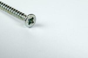 Metal screw plug on white background photo