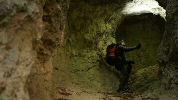 Caucasian Men in His 30s with Flashlight Exploring Grotto. Geological Researcher. video