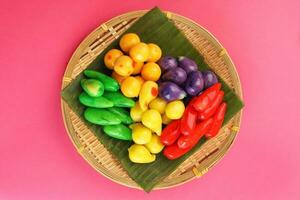 Colourful Luk chup look choop tadeonal Thai desert sweets candy creatve variety bamboo plate banana leaf photo