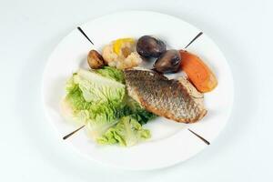 Grilled Seabass vegetable and salad photo