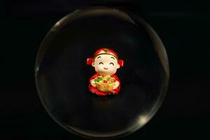 Chinese doll through glass spear photo