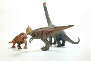 Tyrannosaurus Triceratops Brachiosaurus Dinosaur Toy figurine on white background photo