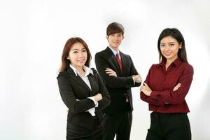 Young attractive one man two woman business office white background stand pose confident look at camera smile photo