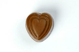 Chocolate truffle hart square cube rose flower shape on white background photo