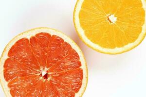 Orange grapefruit slice closeup on white background photo